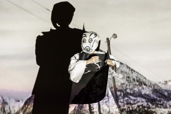 A picture of artist Joan Jonas performing at HANGAR BICOCCA