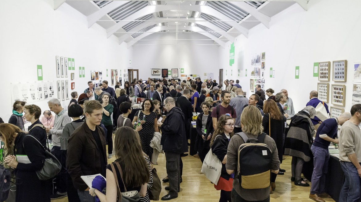 An image showing many people attending the London Art Book Fair. Many of them are reading books artist