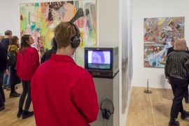 A man listens to an audio artwork in the Whitechapel Gallery exhibition 