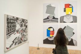 A woman looks at works by Douglas Coupland in Whitechapel Gallery exhibition 