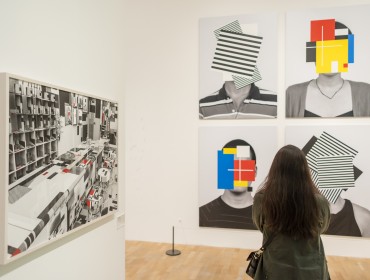 A woman looks at works by Douglas Coupland in Whitechapel Gallery exhibition 