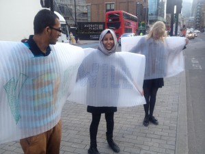A picture of three young people performing on Whitechapel High Street
