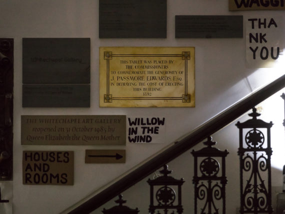 Historic plaques and Peter Liversidge signs intertwine