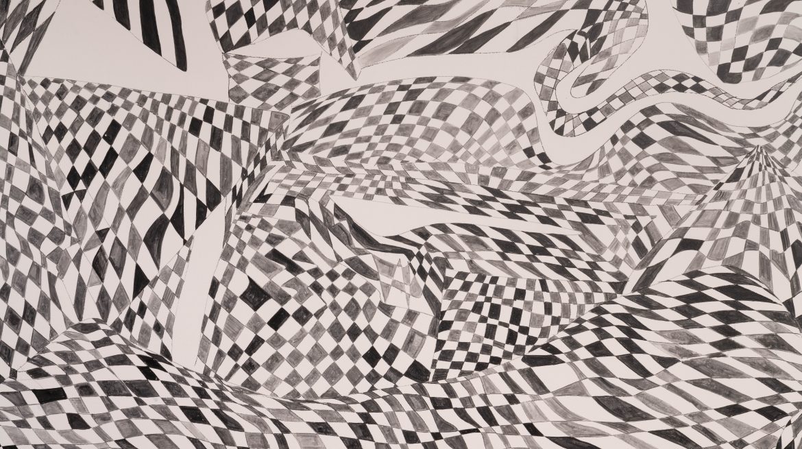 Black and white geometric pattern painted on a wall