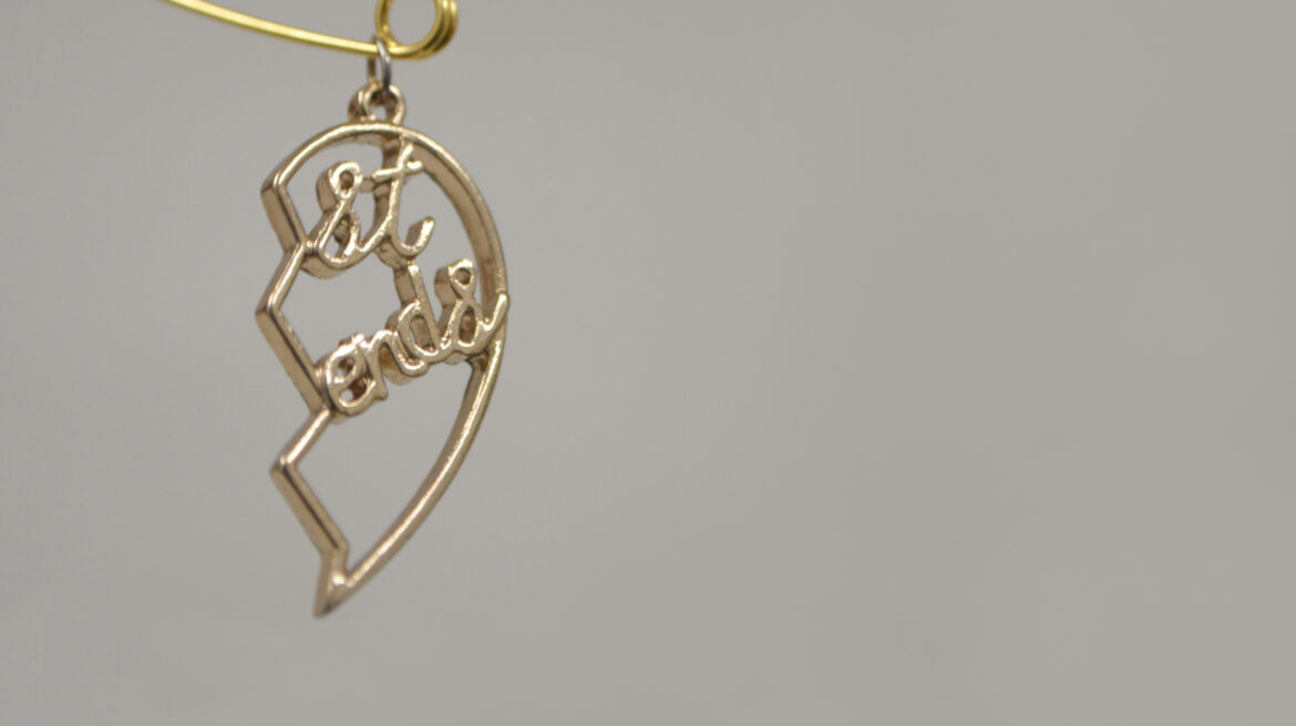 1. Ocean Baulcombe-Toppin, Connection Things (No.2), 2026. Repurposed objects - Split heart necklace pendant, safety pin