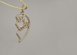 1. Ocean Baulcombe-Toppin, Connection Things (No.2), 2026. Repurposed objects – Split heart necklace pendant, safety pin